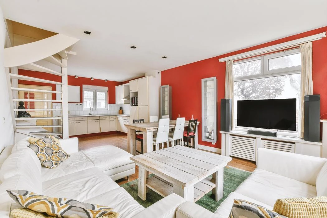 Red accent wall in a living room