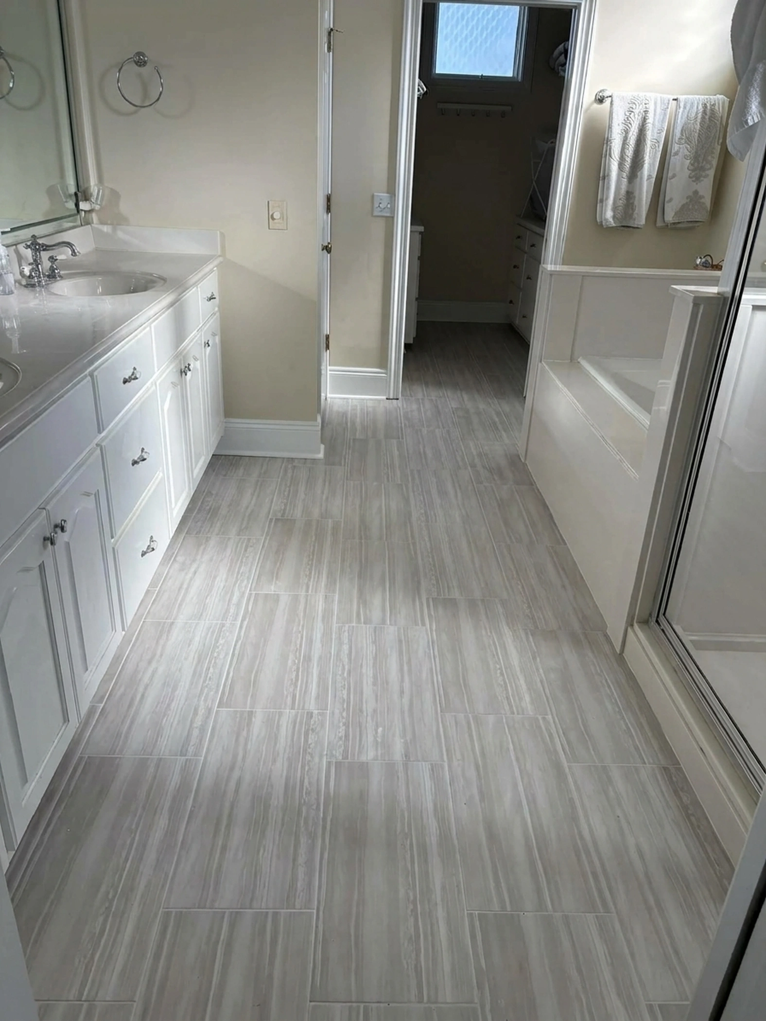 Luxury master bathroom double vanity with fresh white cabinetry