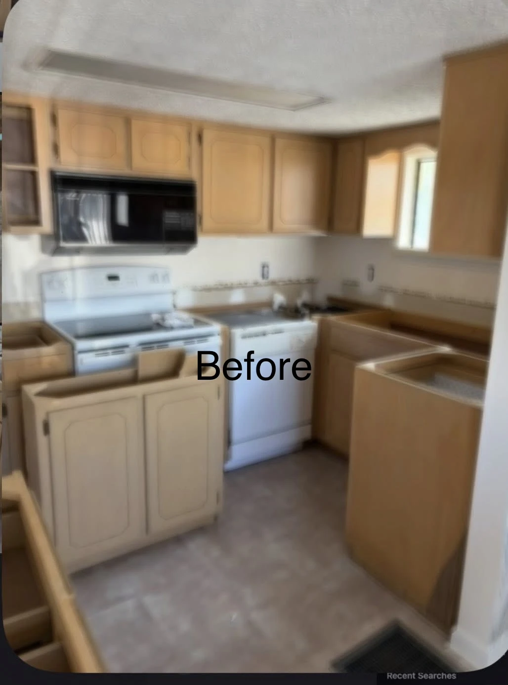 Dated honey oak kitchen cabinets during prep and renovation