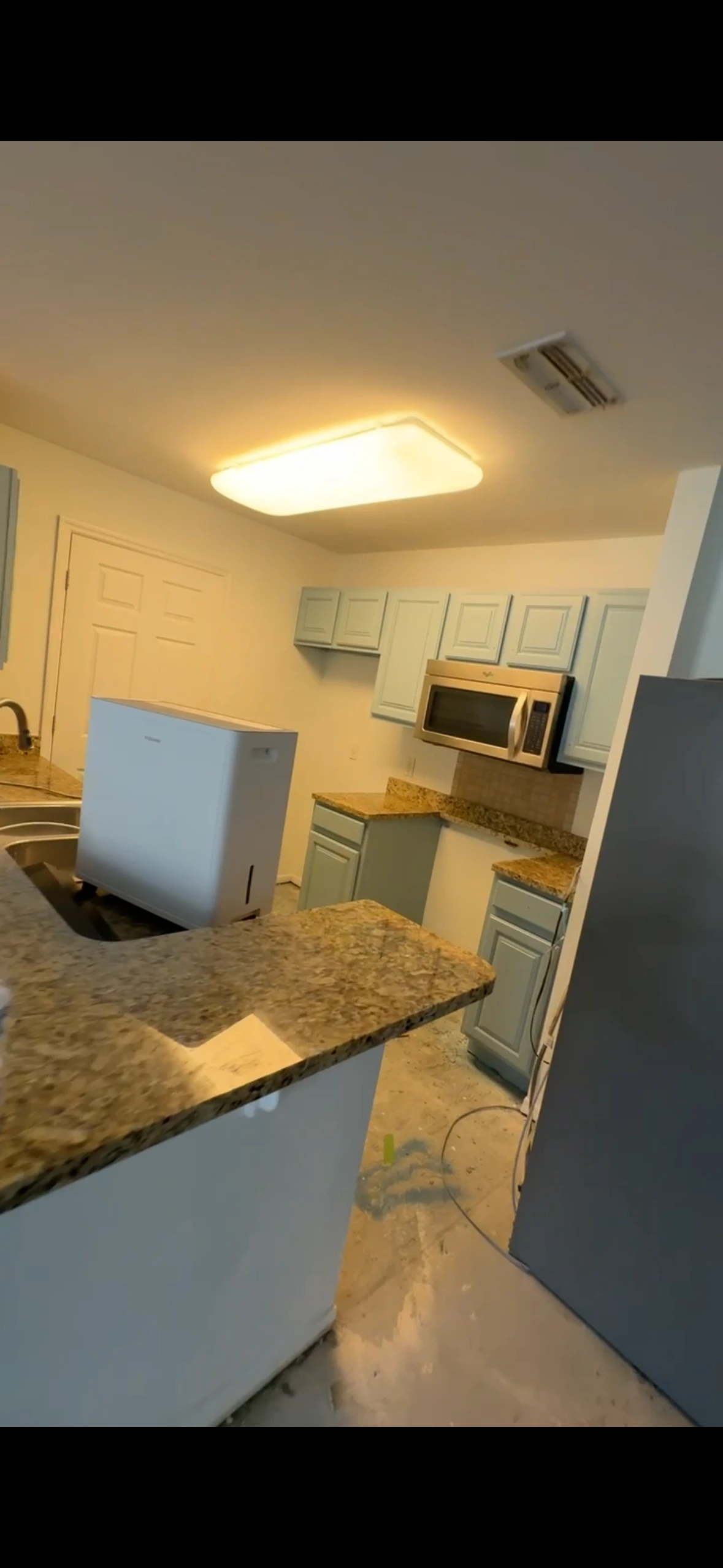 Kitchen cabinets sprayed in coastal powder blue satin finish after refinishing